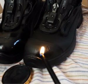 Polishing-military-boots-with-lighter